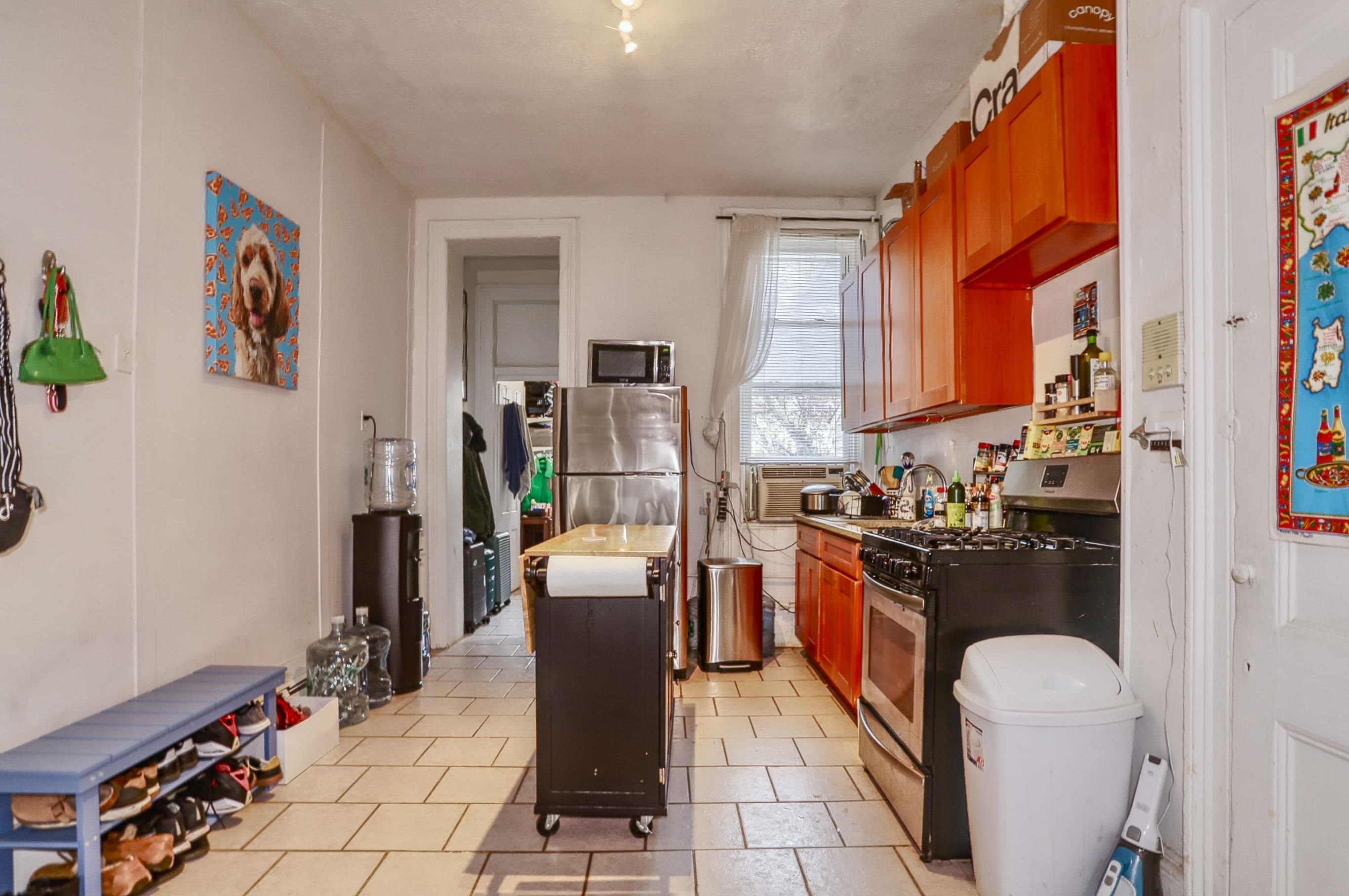 521 Willow Avenue, Unit 1R Hoboken, NJ 07030 - Photo 2 of 15 a kitchen with a stove a refrigerator and wooden floor