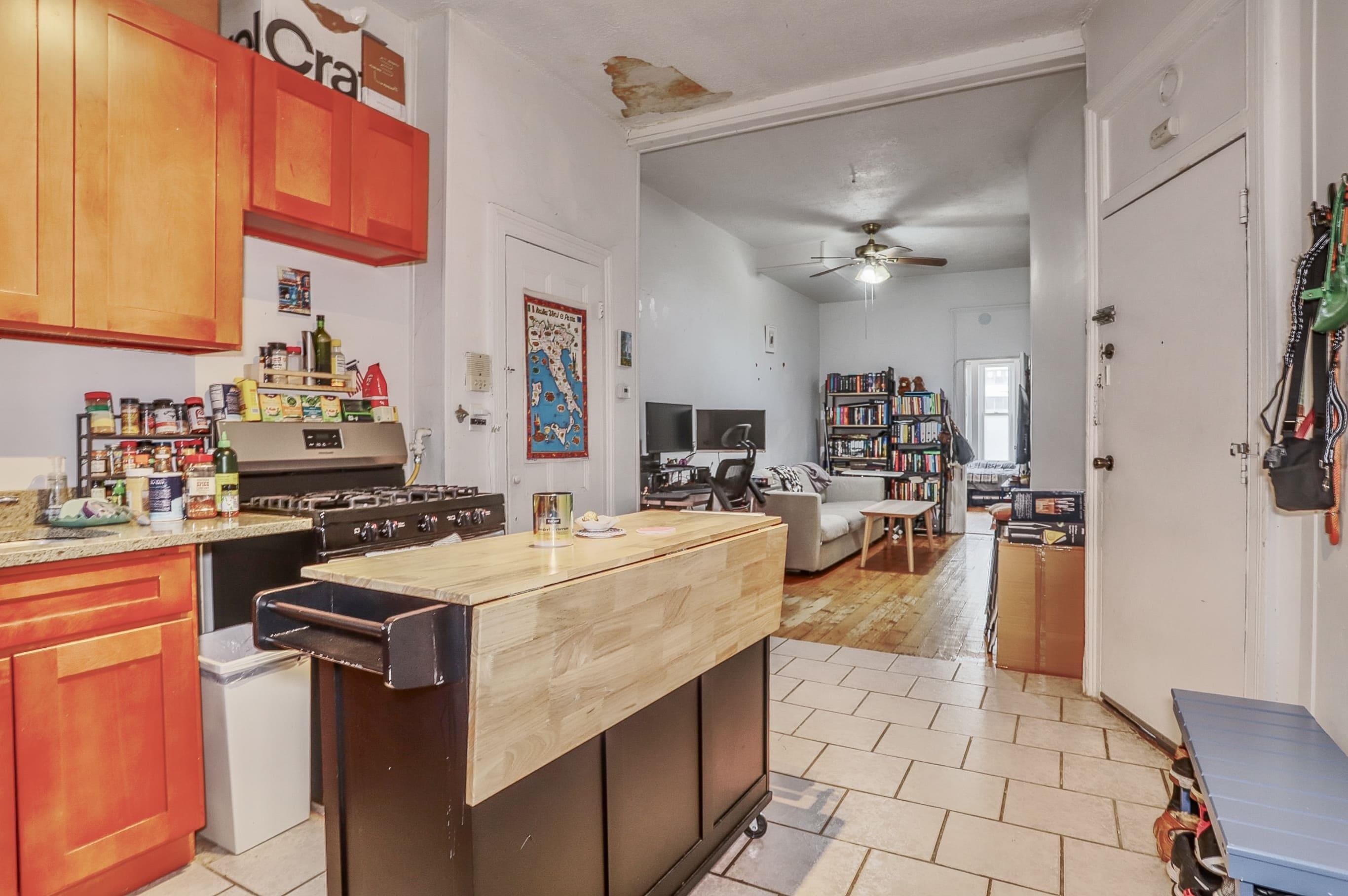 521 Willow Avenue, Unit 1R Hoboken, NJ 07030 - Photo 3 of 15 a kitchen with stainless steel appliances granite countertop a sink a stove and a refrigerator