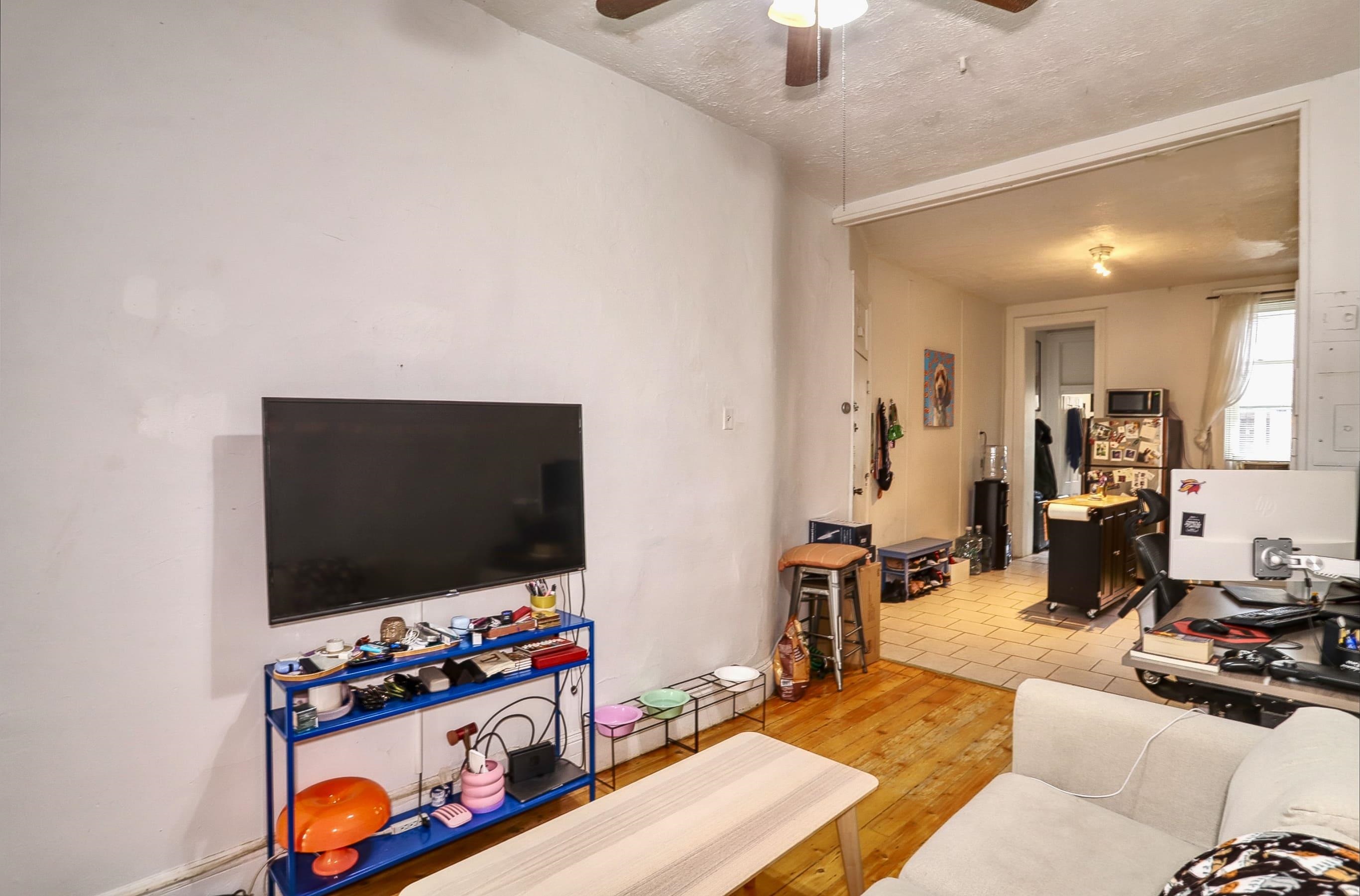 521 Willow Avenue, Unit 1R Hoboken, NJ 07030 - Photo 4 of 15 a living room with furniture and a flat screen tv