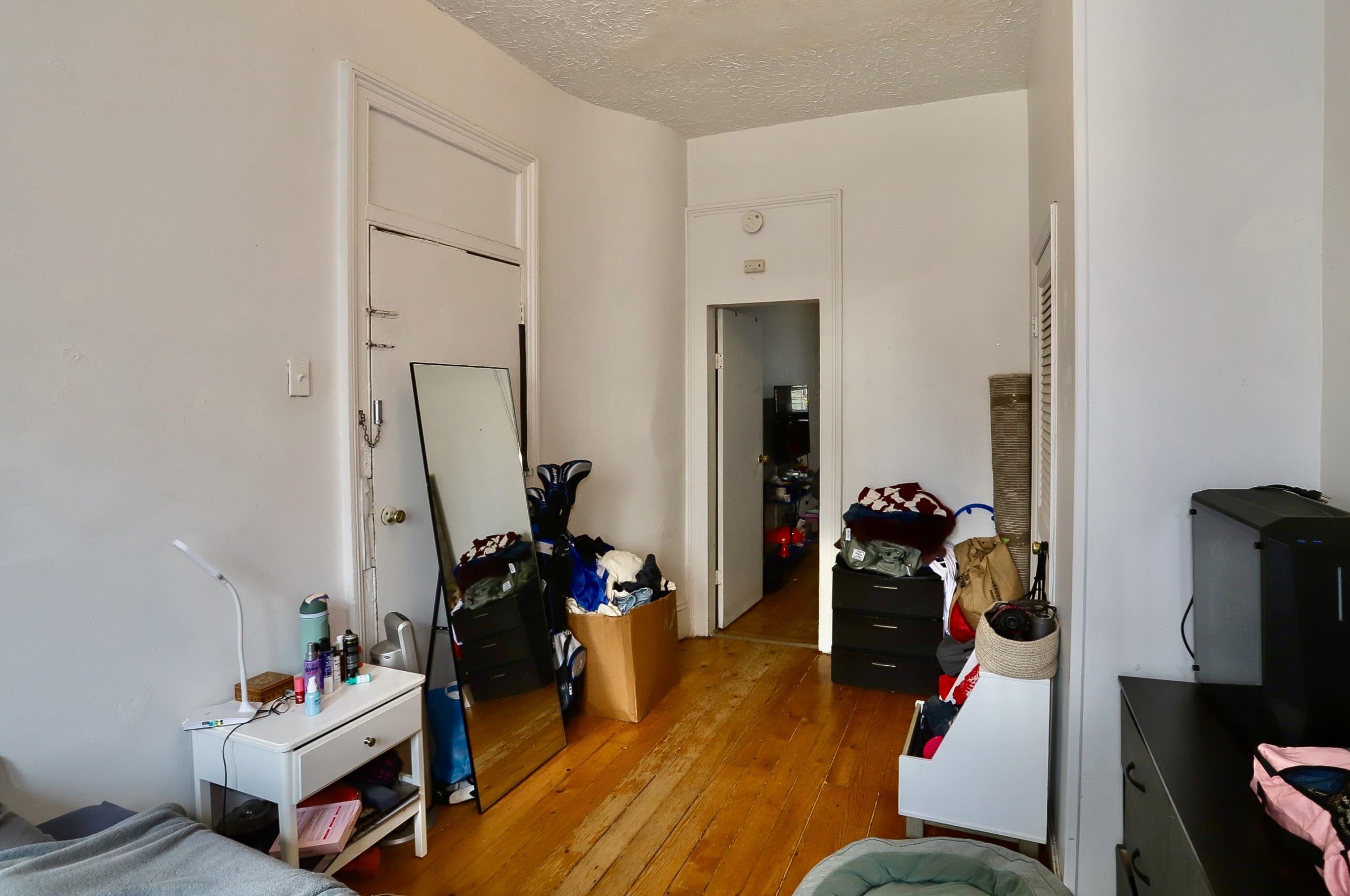 521 Willow Avenue, Unit 1R Hoboken, NJ 07030 - Photo 8 of 15 a living room with furniture and a wooden floor