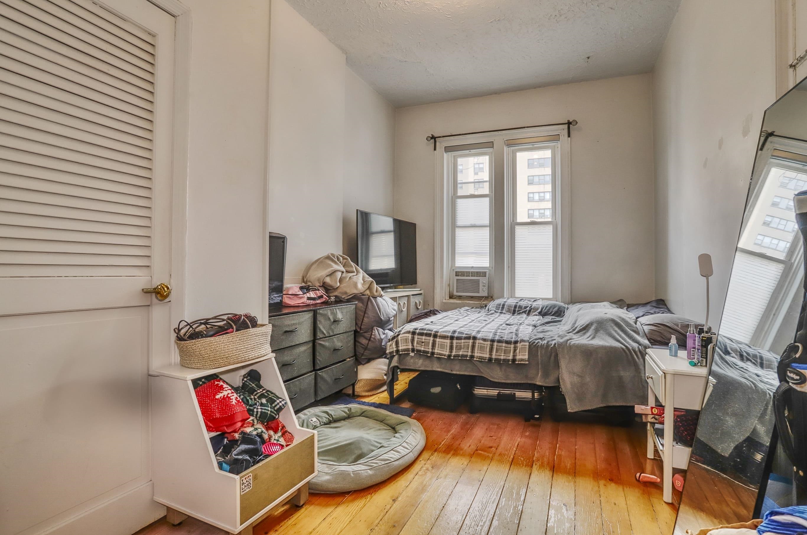 521 Willow Avenue, Unit 1R Hoboken, NJ 07030 - Photo 9 of 15 a bedroom with a bed and a window