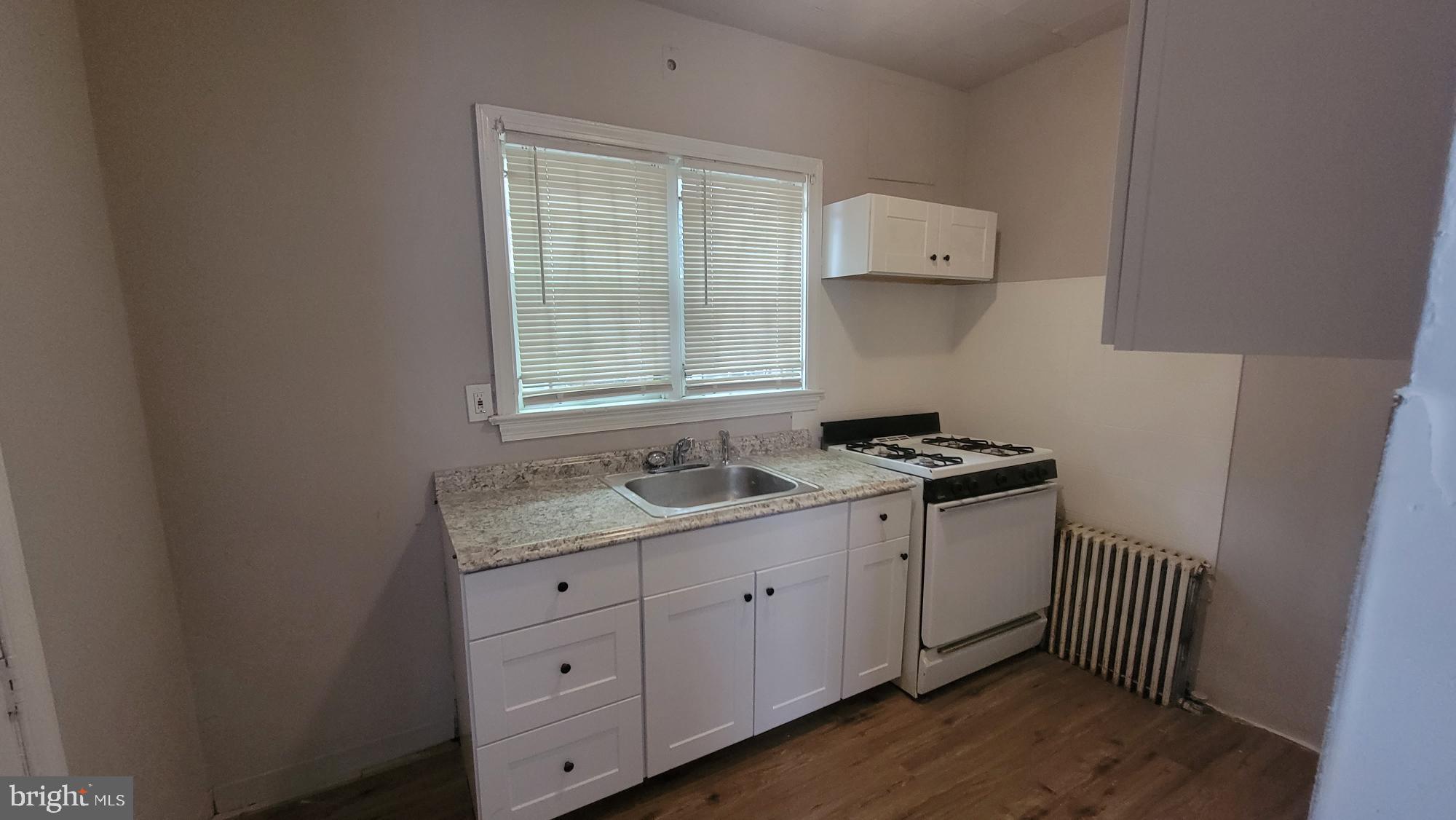 3208 D Street Philadelphia, PA 19134 - Photo 11 of 33 a room with a sink cabinets and a window