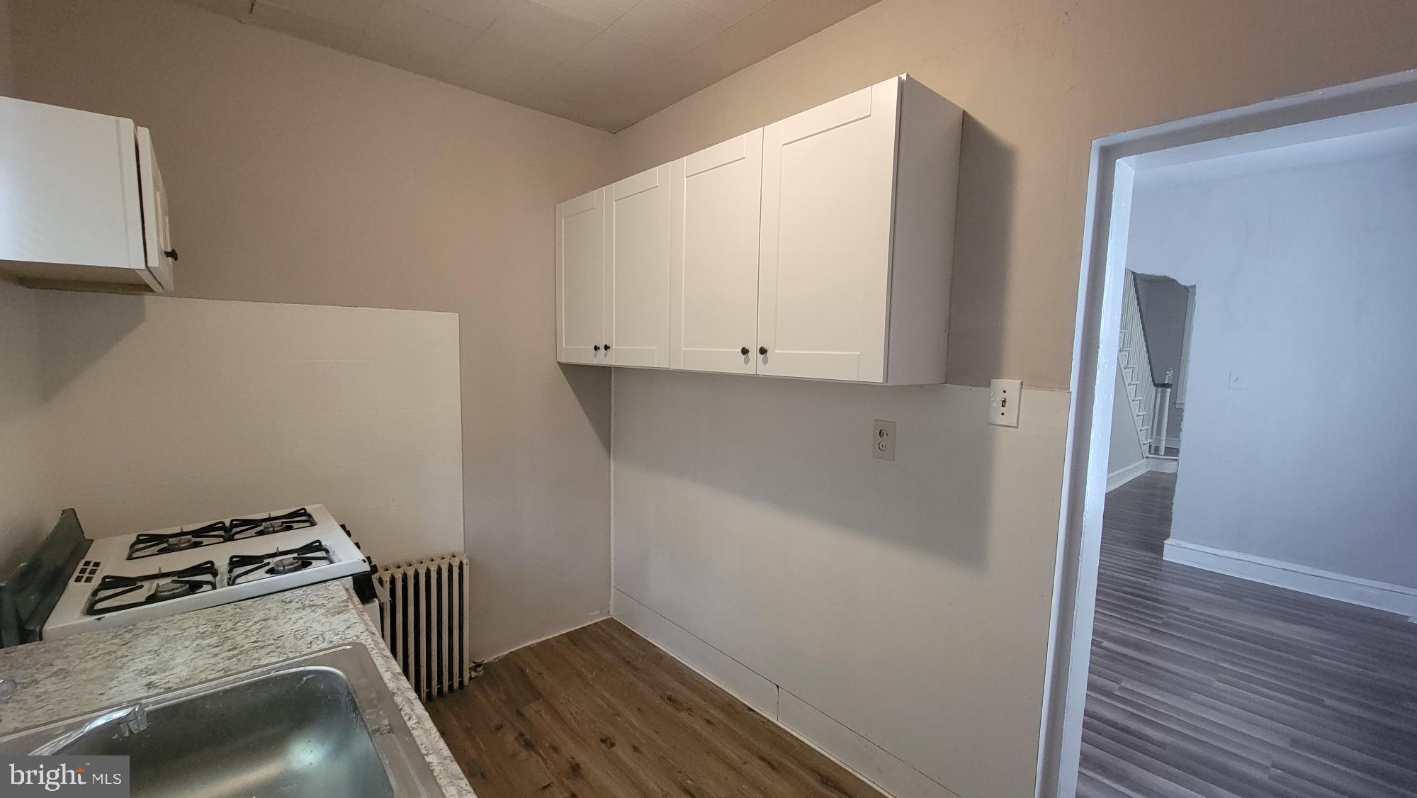 3208 D Street Philadelphia, PA 19134 - Photo 12 of 33 a view of storage and utility room with wooden floor