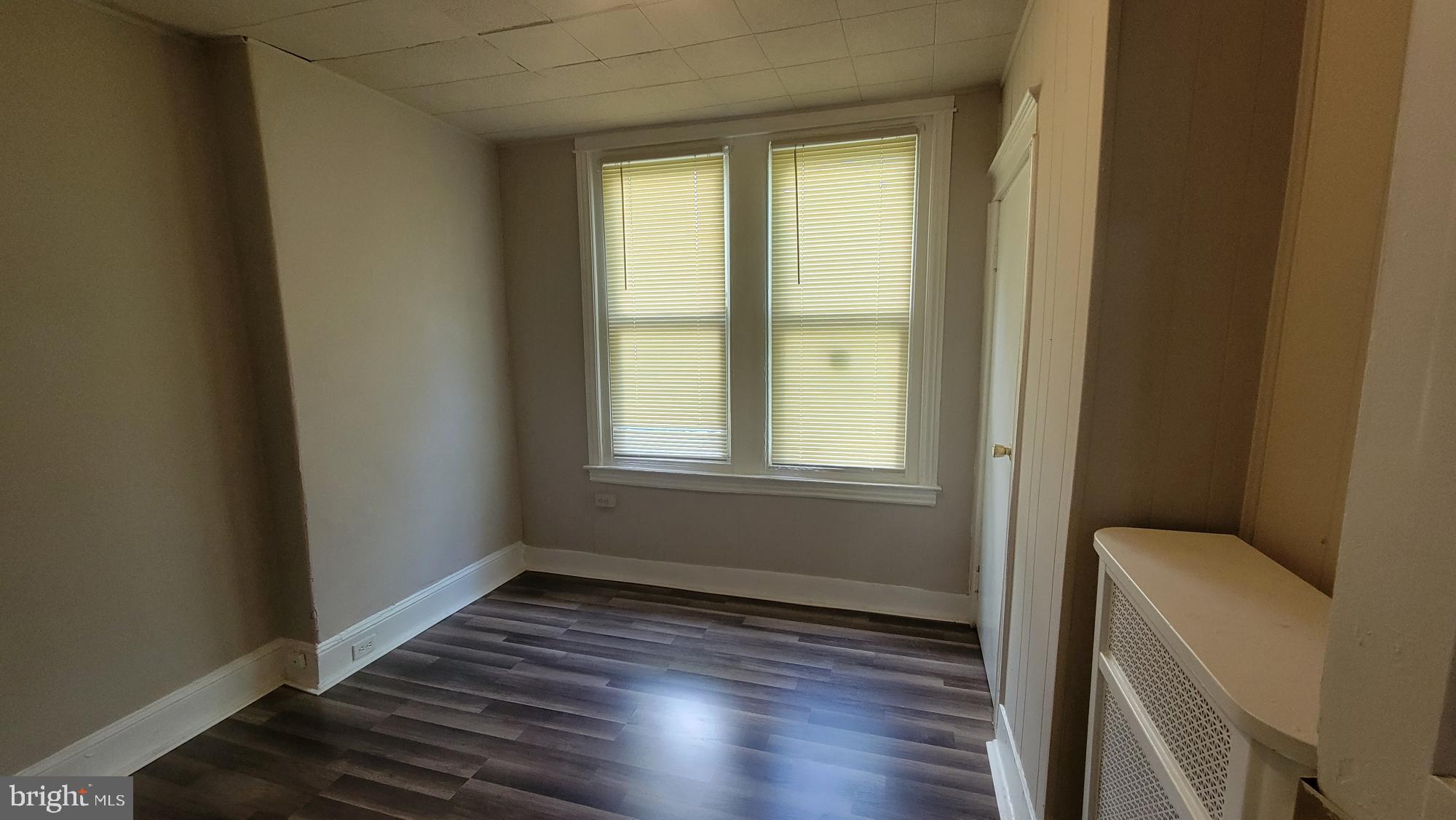 3208 D Street Philadelphia, PA 19134 - Photo 18 of 33 a view of an empty room with wooden floor and a window