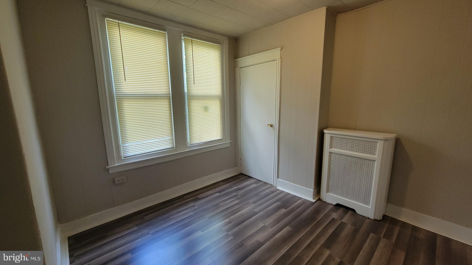 3208 D Street Philadelphia, PA 19134 - Photo 20 of 33 an empty room with wooden floor and windows