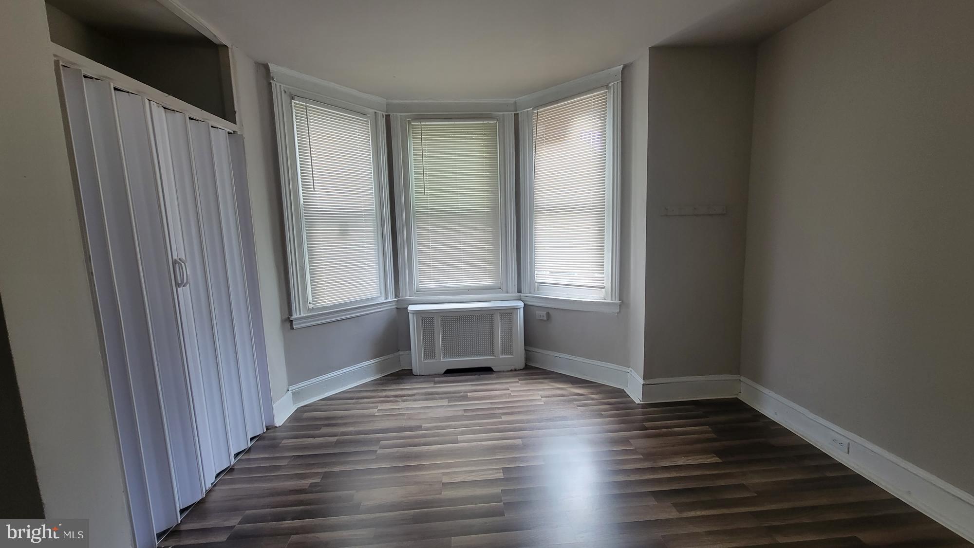 3208 D Street Philadelphia, PA 19134 - Photo 28 of 33 a view of an empty room with wooden floor and a window