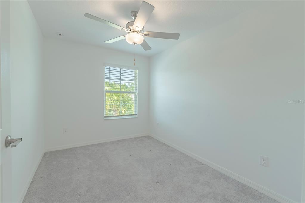 21395 Darter Road Land O' Lakes, FL 34638 - Photo 14 of 22 an empty room with windows and fan