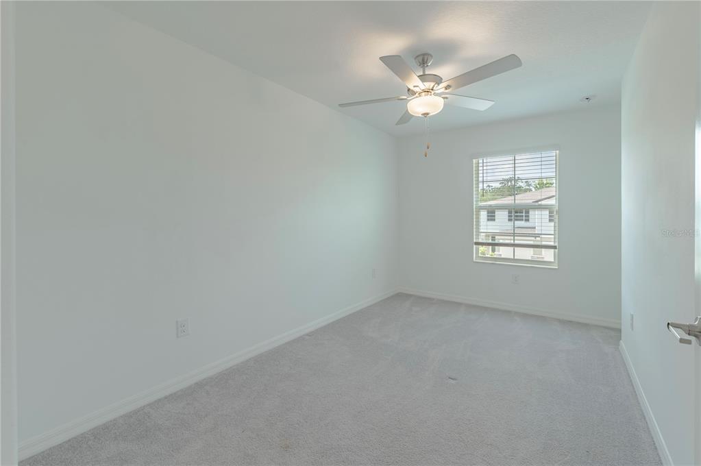 21395 Darter Road Land O' Lakes, FL 34638 - Photo 15 of 22 a view of an empty room with a window