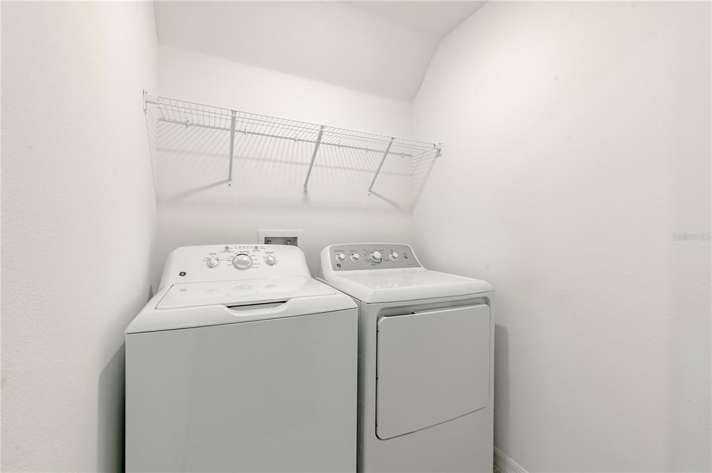 21395 Darter Road Land O' Lakes, FL 34638 - Photo 19 of 22 a utility room with dryer and washer