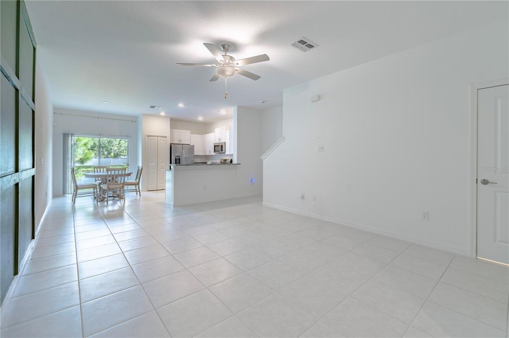 21395 Darter Road Land O' Lakes, FL 34638 - Photo 4 of 22 a view of a livingroom with furniture and chandelier fan