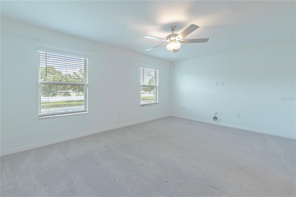 21395 Darter Road Land O' Lakes, FL 34638 - Photo 10 of 22 a view of an empty room with a window