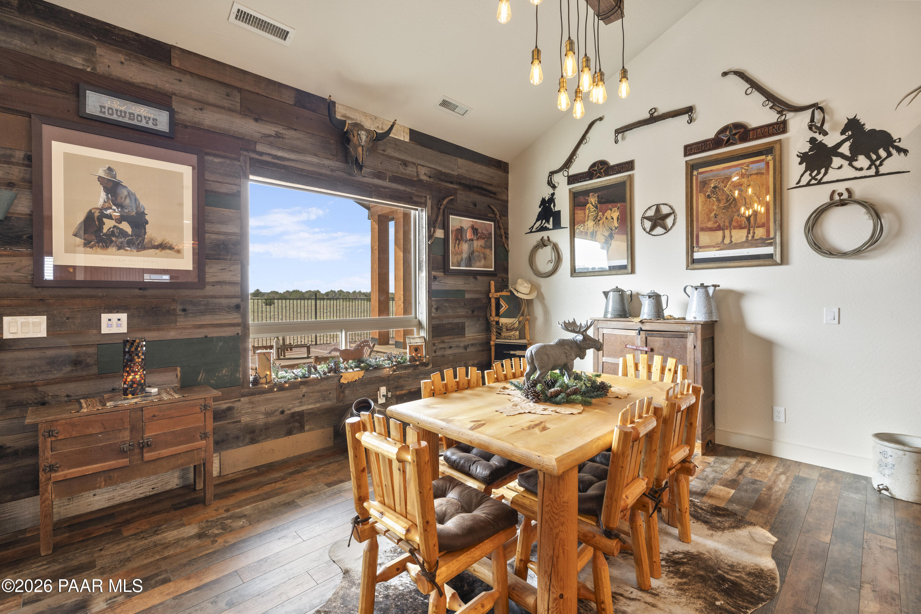 1399 East Western Way Paulden, AZ 86334 - Photo 15 of 44 a view of a dining room with furniture a chandelier and wooden floor