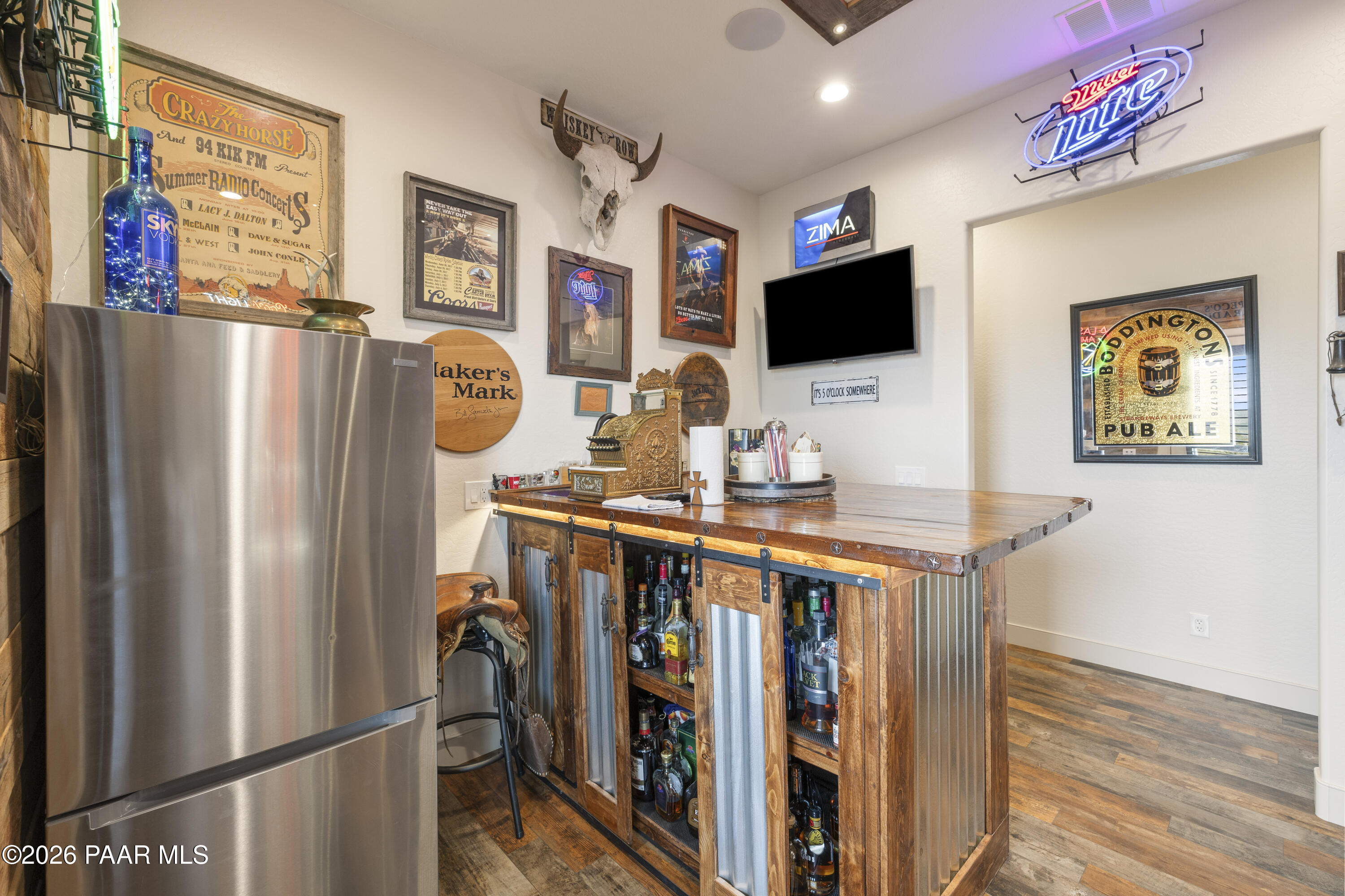 1399 East Western Way Paulden, AZ 86334 - Photo 20 of 44 a view of a livingroom with furniture hardwood floor and a flat screen tv