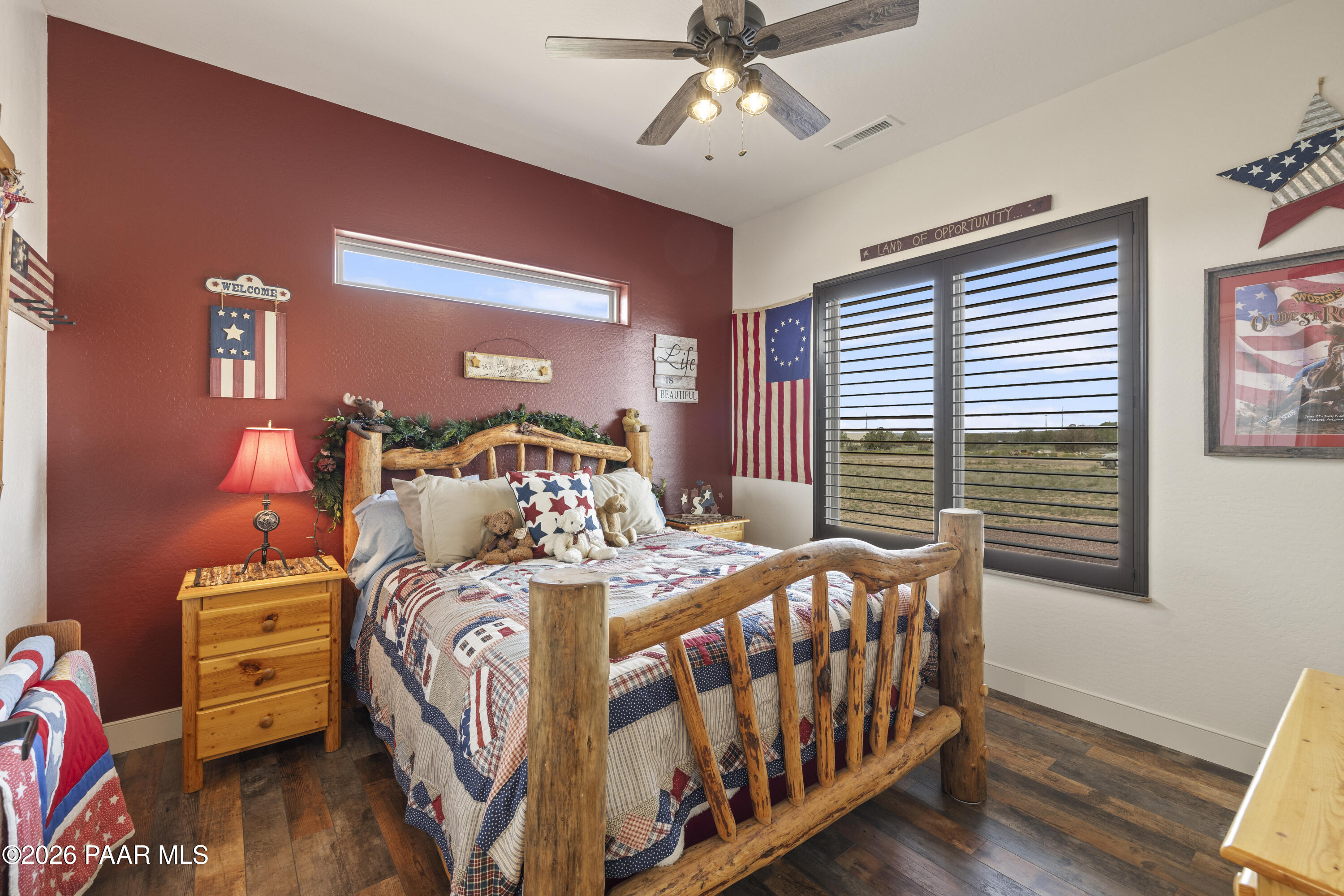 1399 East Western Way Paulden, AZ 86334 - Photo 25 of 44 a bedroom with a bed and wooden floor