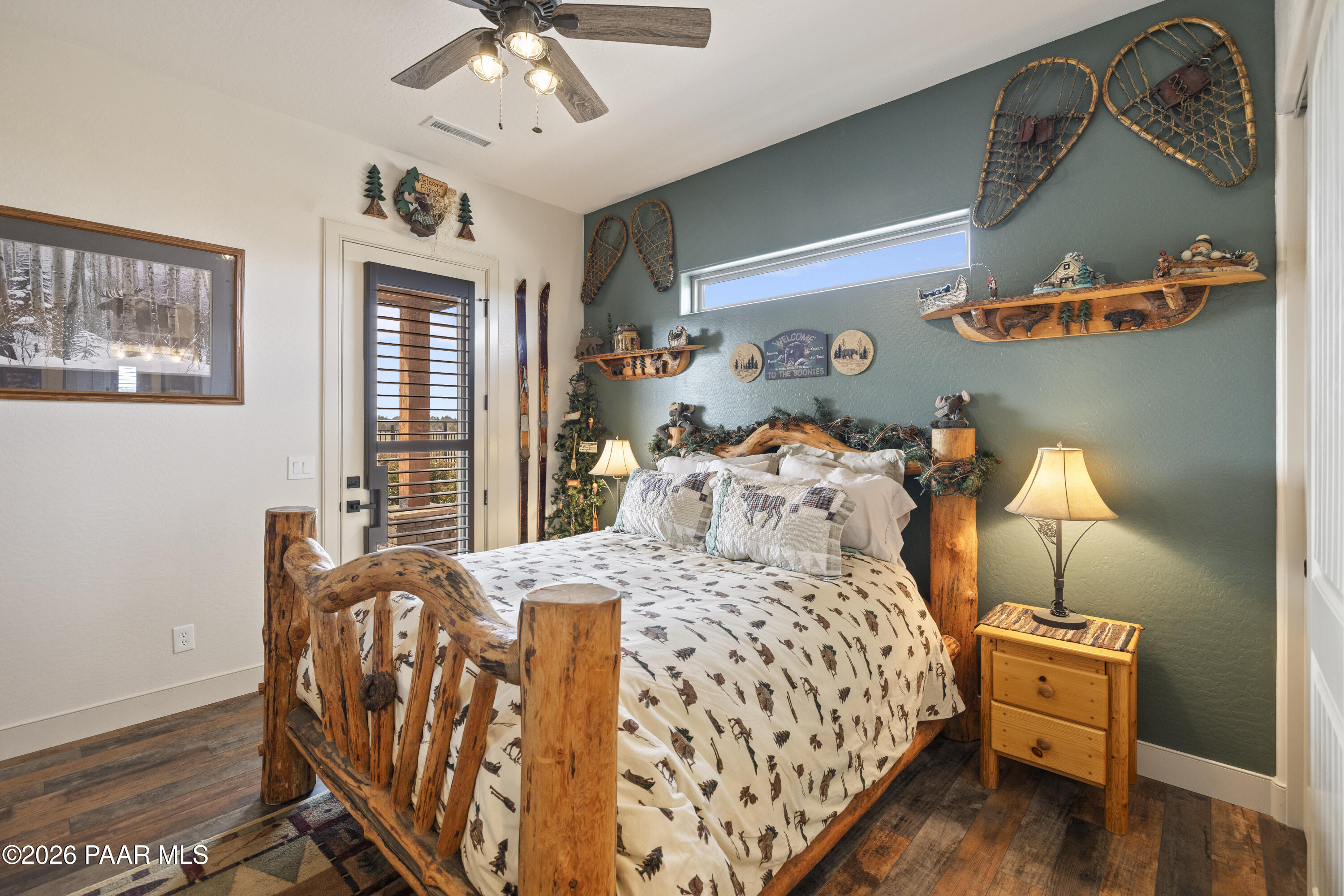 1399 East Western Way Paulden, AZ 86334 - Photo 28 of 44 a bedroom with a bed and wooden floor
