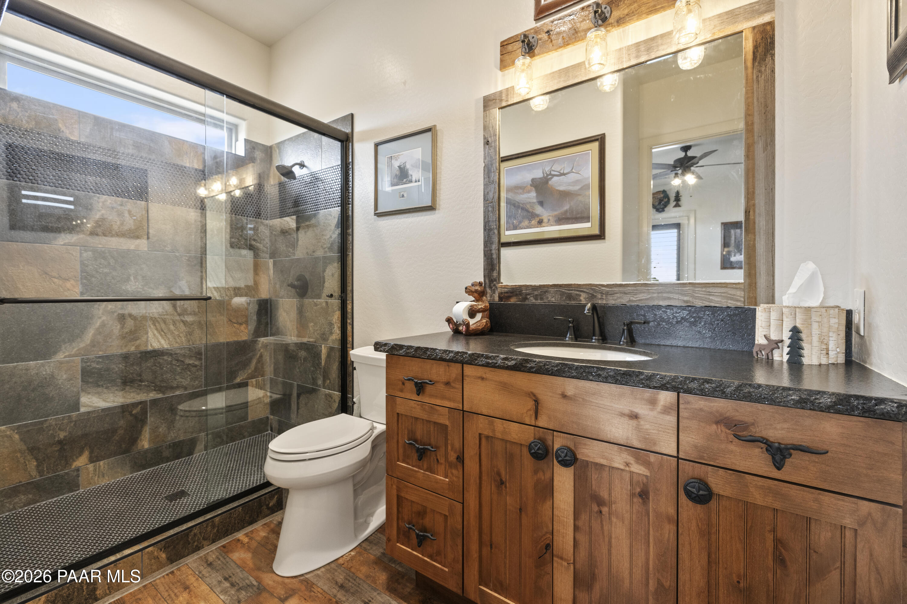 1399 East Western Way Paulden, AZ 86334 - Photo 30 of 44 a bathroom with a granite countertop sink toilet and shower