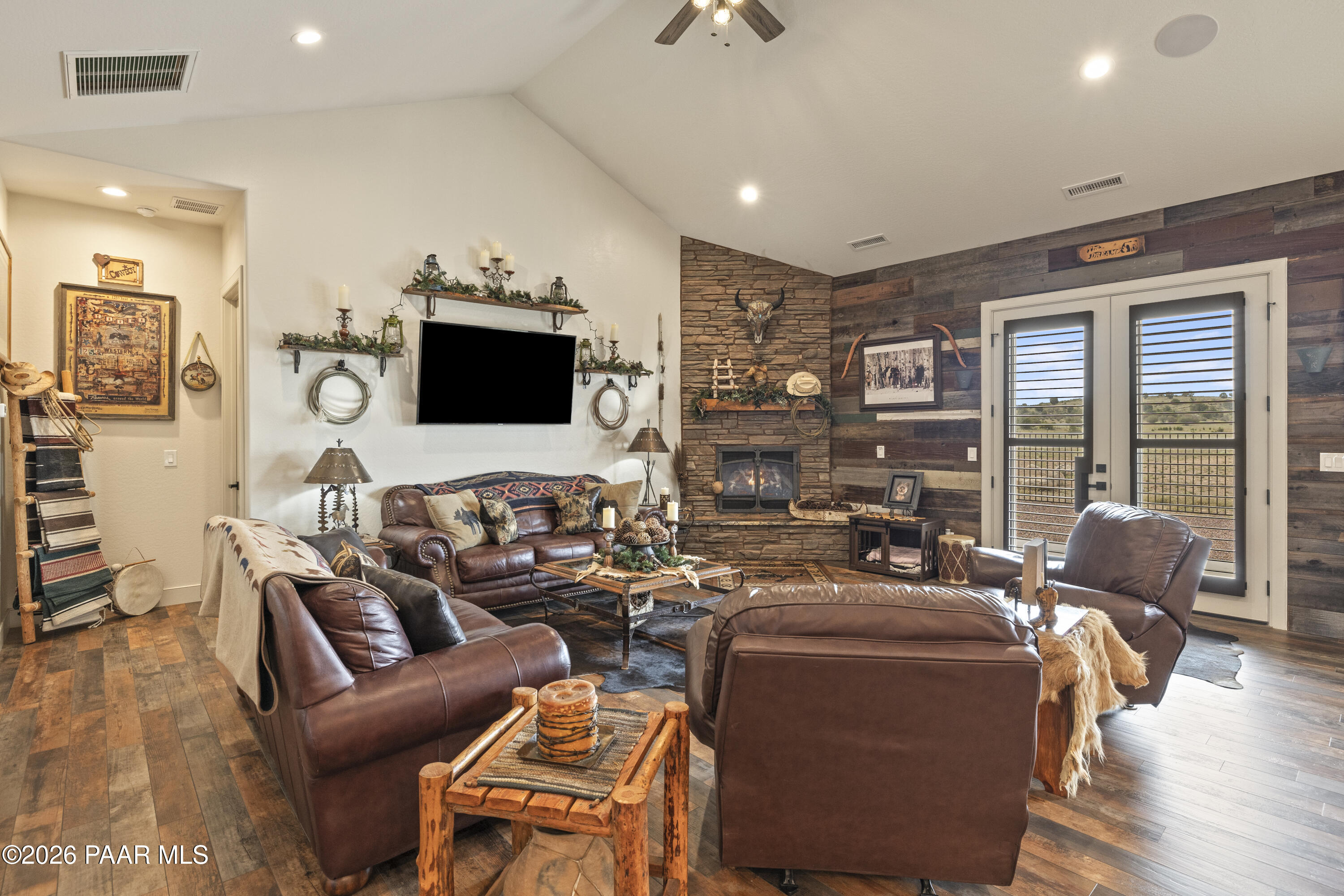 1399 East Western Way Paulden, AZ 86334 - Photo 7 of 44 a media room with lots of chairs and a flat screen tv