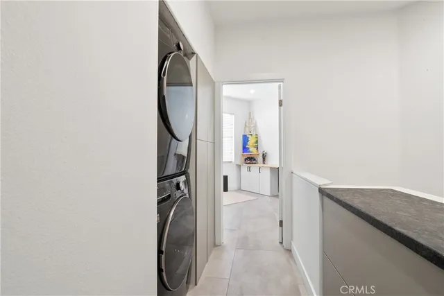 a view of a storage and utility room with washer and dryer