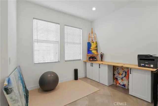 a room with a chair and a window