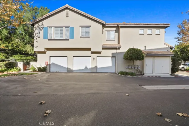 a view of a house with a street