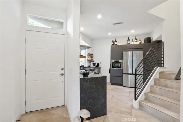 a view of a living room and entryway with wooden floor