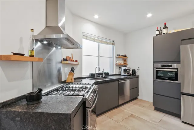 a kitchen with a stove and a refrigerator