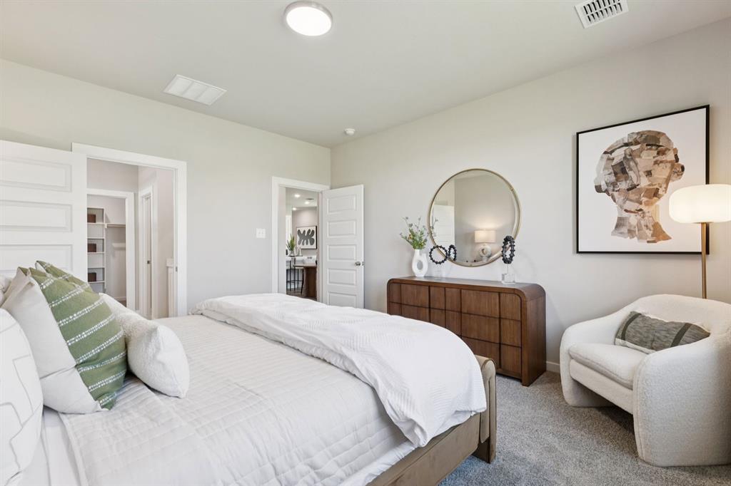 312 Millwood Road Lavon, TX 75166 - Photo 13 of 28 a bedroom with a bed and a couch