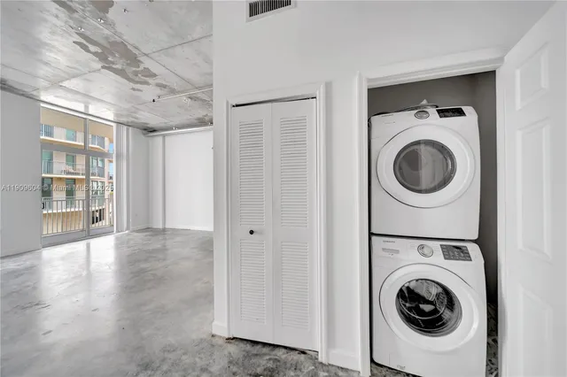 a view of a storage & utility room with washer and dryer