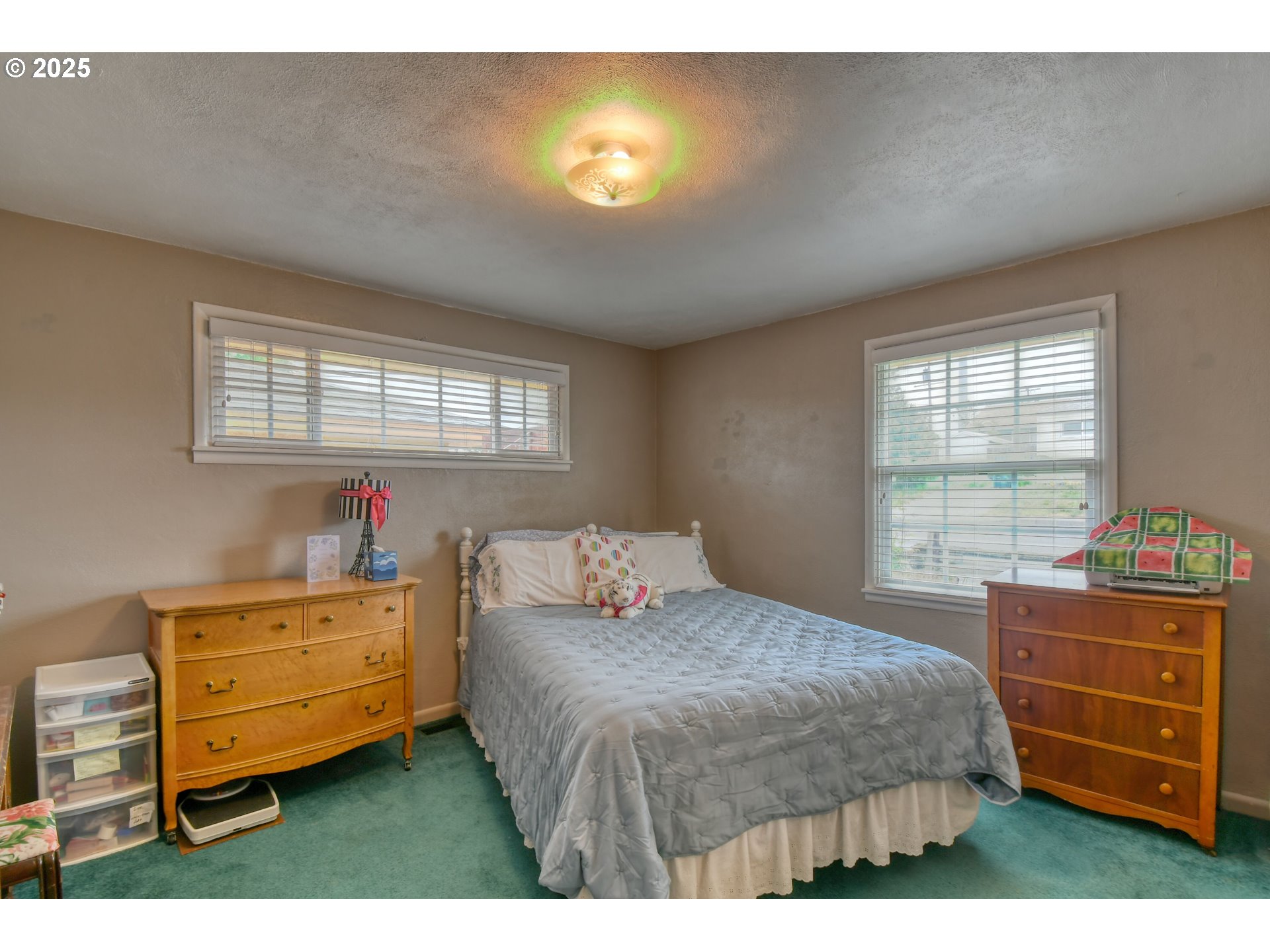 728 Southeast 6th Street Pendleton, OR 97801 - Photo 12 of 34 a bedroom with a bed and a dresser