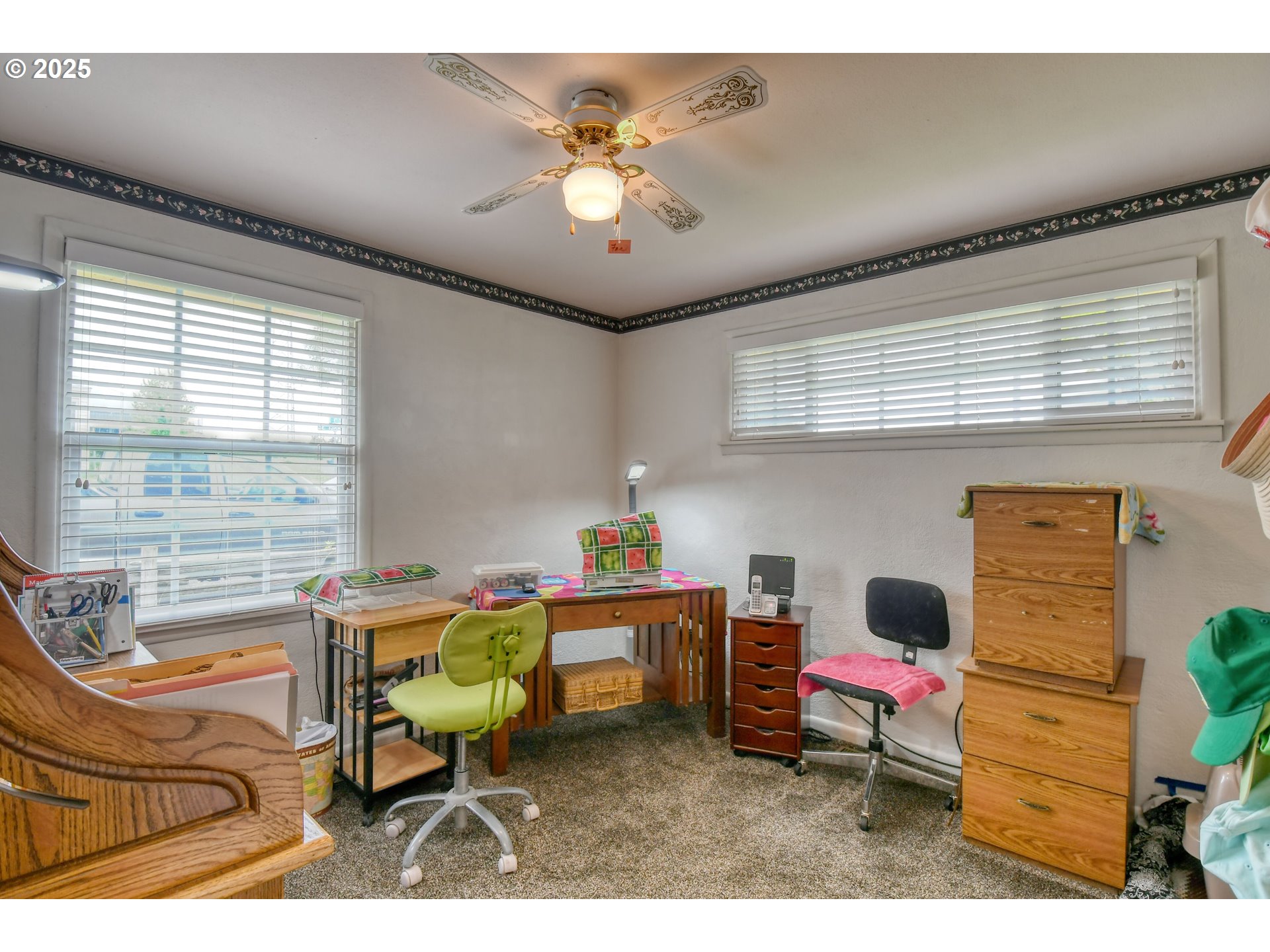 728 Southeast 6th Street Pendleton, OR 97801 - Photo 18 of 34 a living room with furniture a chandelier and a window