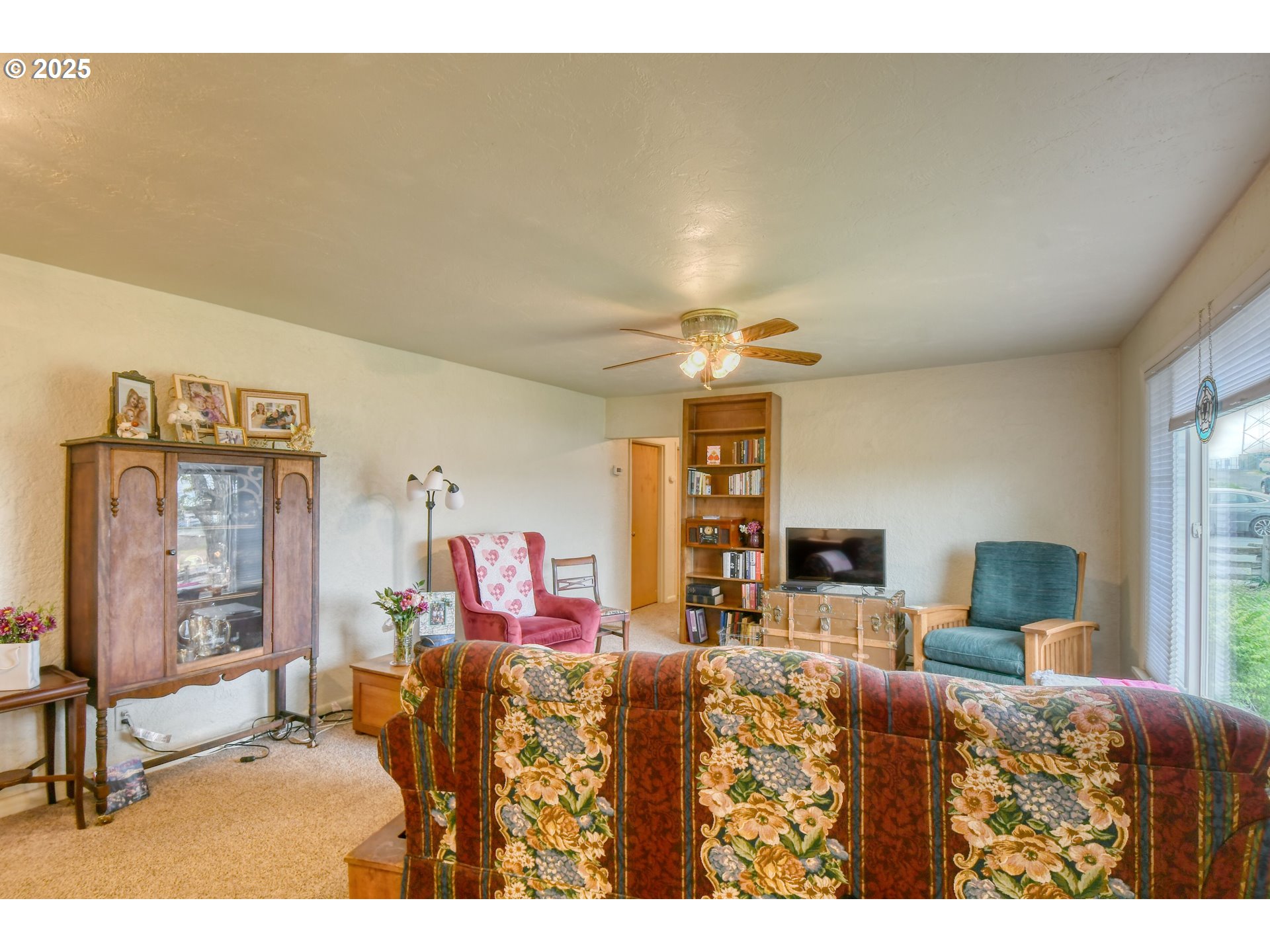 728 Southeast 6th Street Pendleton, OR 97801 - Photo 6 of 34 a living room with furniture and a chandelier