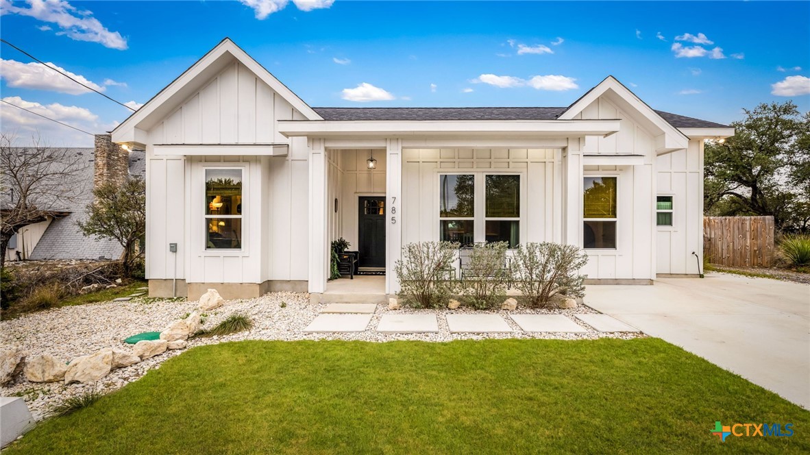 front view of a house with a yard