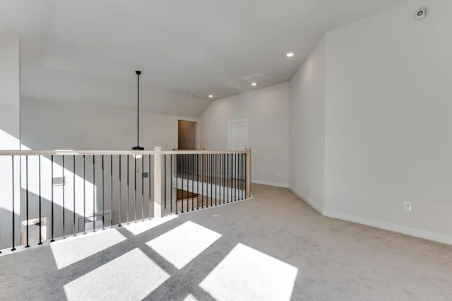 a view of a hallway with windows