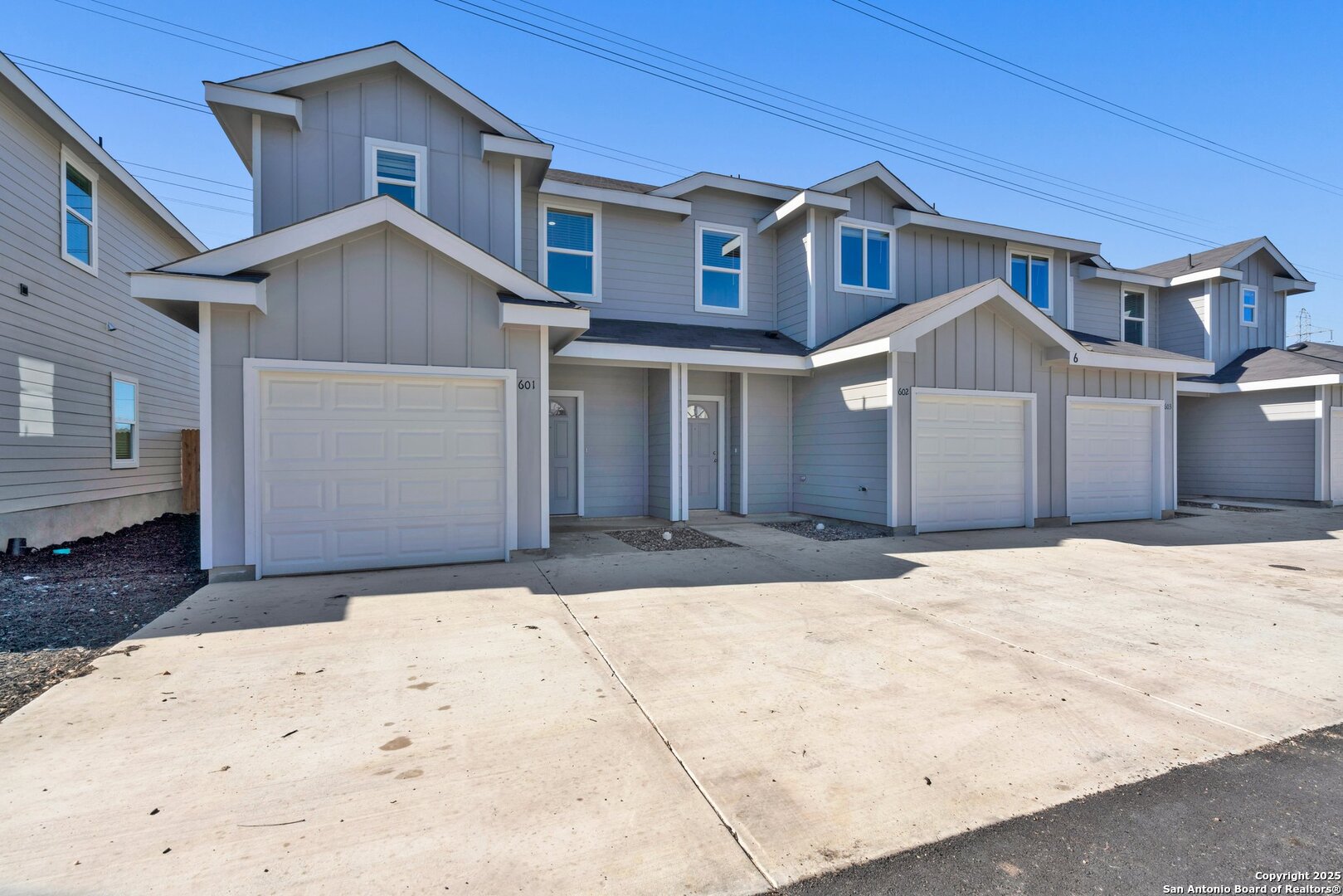 9426 Apple Ridge Lane, Unit 303 San Antonio, TX 78239 - Photo 1 of 25 a front view of a house with a yard