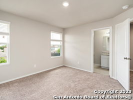 9426 Apple Ridge Lane, Unit 303 San Antonio, TX 78239 - Photo 21 of 25 an empty room with windows and closet