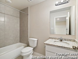 9426 Apple Ridge Lane, Unit 303 San Antonio, TX 78239 - Photo 5 of 25 a bathroom with a granite countertop sink toilet and shower