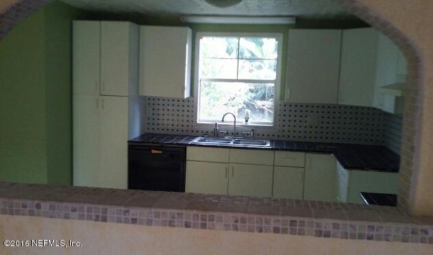 2038 Blair Road Jacksonville, FL 32221 - Photo 6 of 7 a kitchen with a cabinets and window