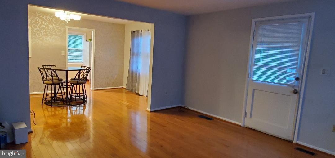 8512 Imperial Drive, Unit 1H Laurel, MD 20708 - Photo 4 of 14 an empty room with windows