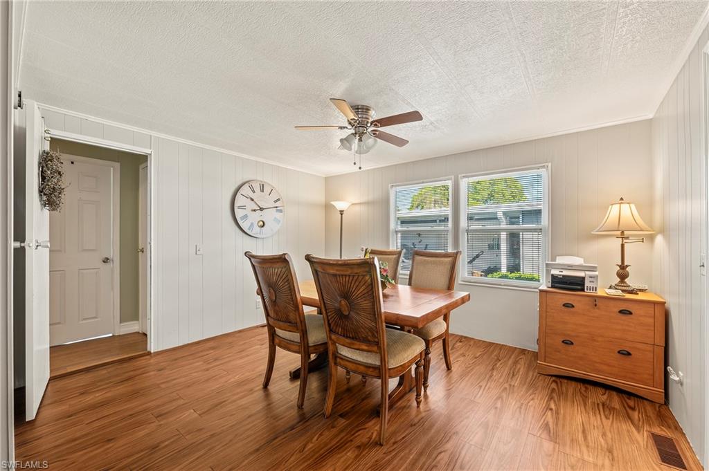 284 Cape Sable Drive Naples, FL 34104 - Photo 4 of 20 a view of a dining room with furniture window and wooden floor