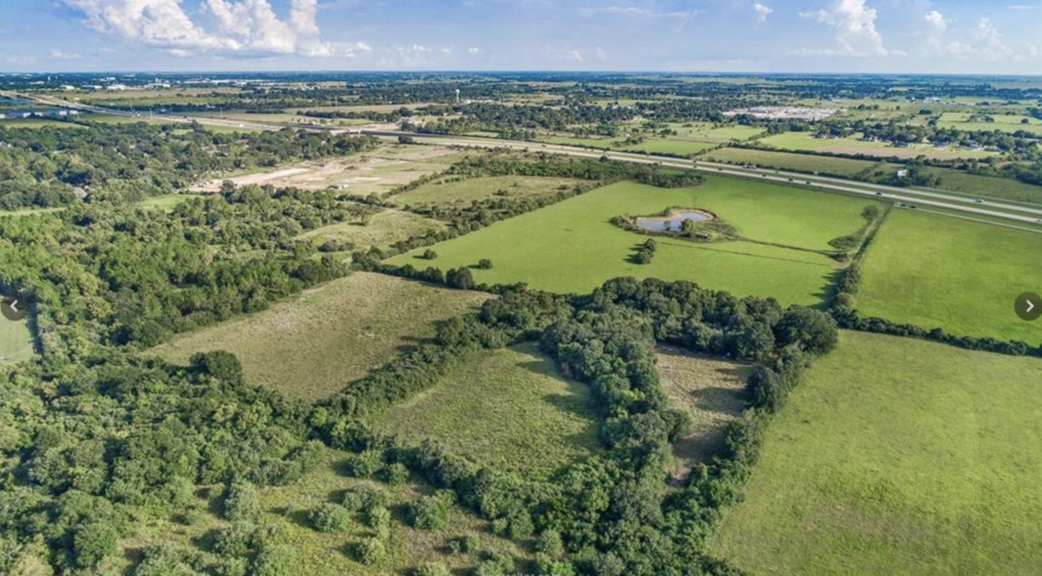 45110 Frontage Road Prairie View, TX 77446 - Photo 6 of 7 a view of a lake with a big yard