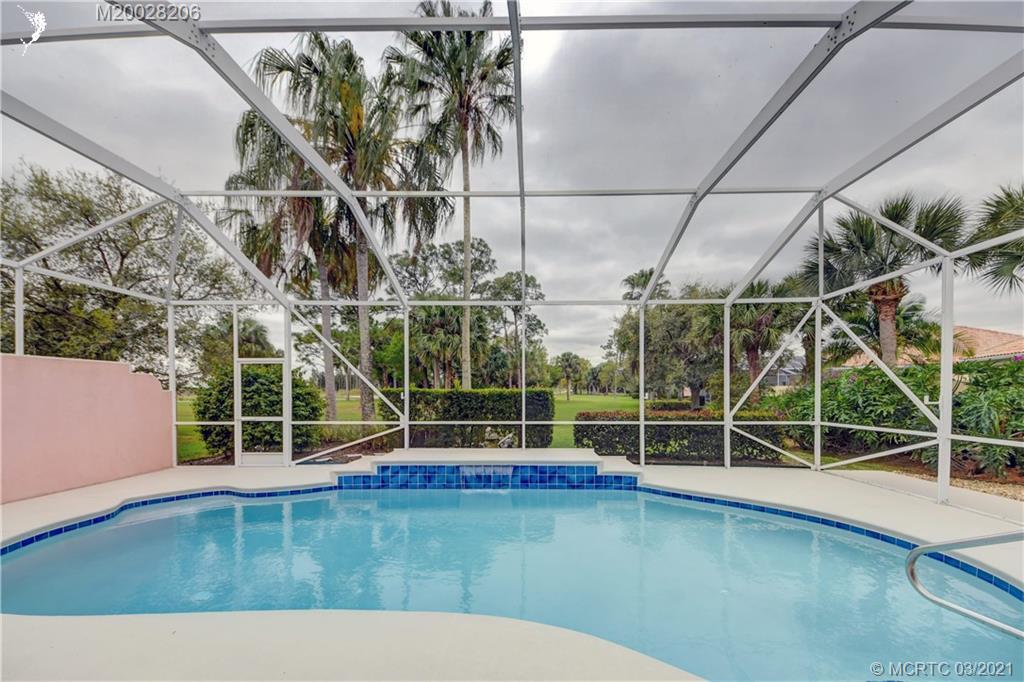 1530 Southwest Balmoral Trace Stuart, FL 34997 - Photo 1 of 48 Pool area and view of 12th tee box