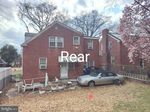 a front view of a house with parking space