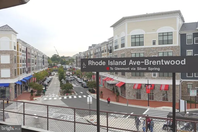a view of street with retail shops