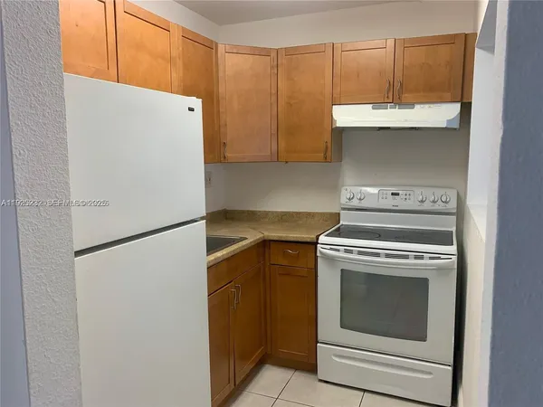 a view of a kitchen with washer and dryer