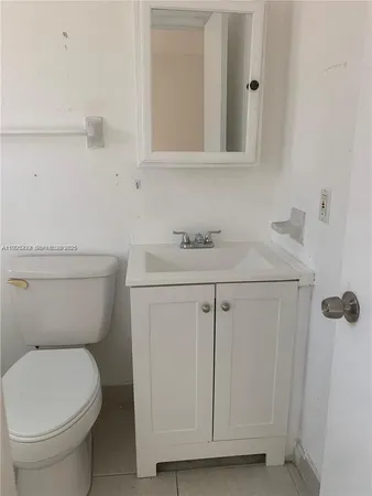 a bathroom with a toilet and bathtub