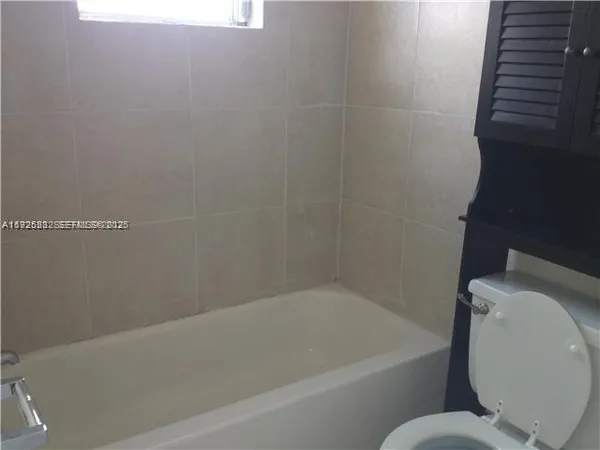 a bathroom with a toilet and a sink
