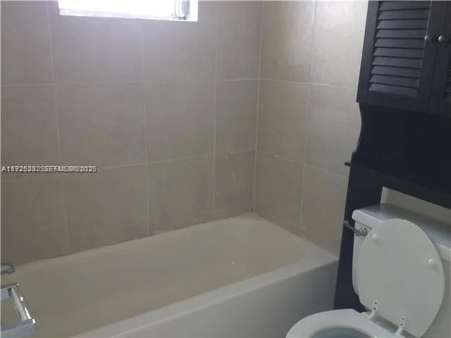 a bathroom with a toilet and a sink