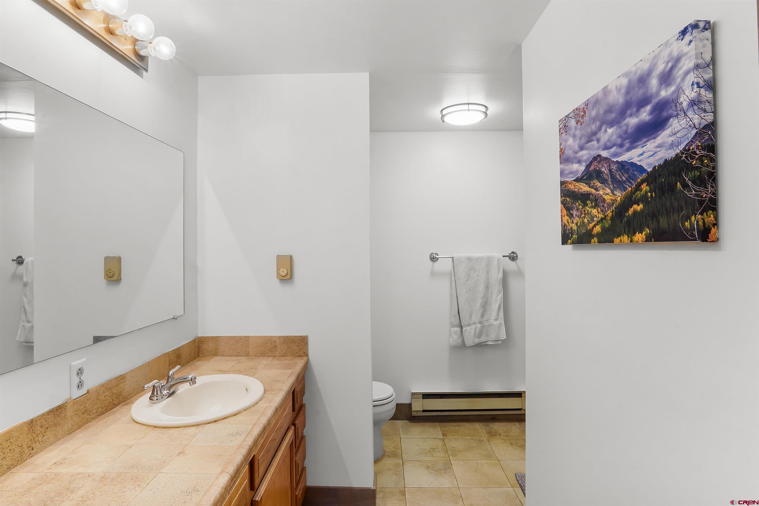 78 Groves Drive Durango, CO 81301 - Photo 21 of 35 a bathroom with a granite countertop sink