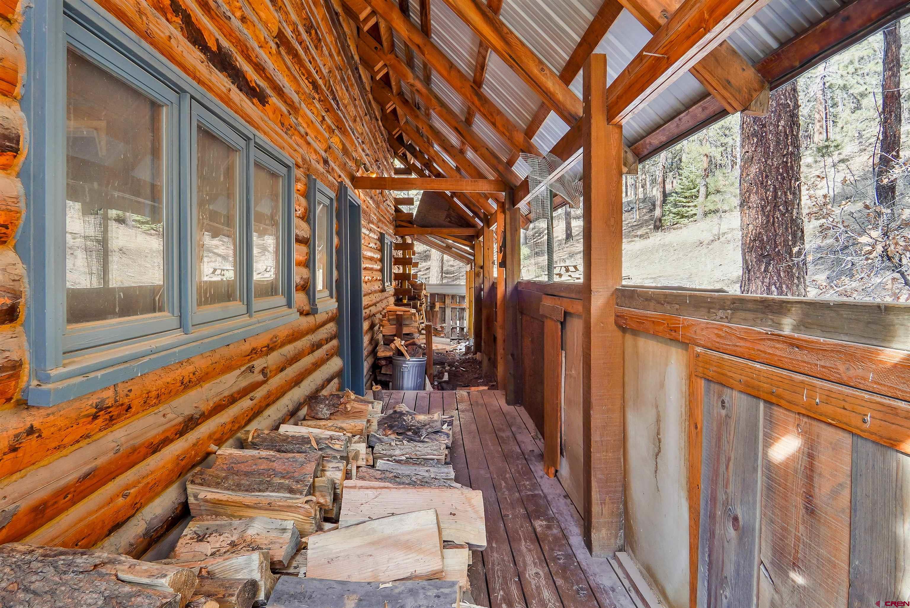 78 Groves Drive Durango, CO 81301 - Photo 29 of 35 a view of an entryway with wooden floor and door
