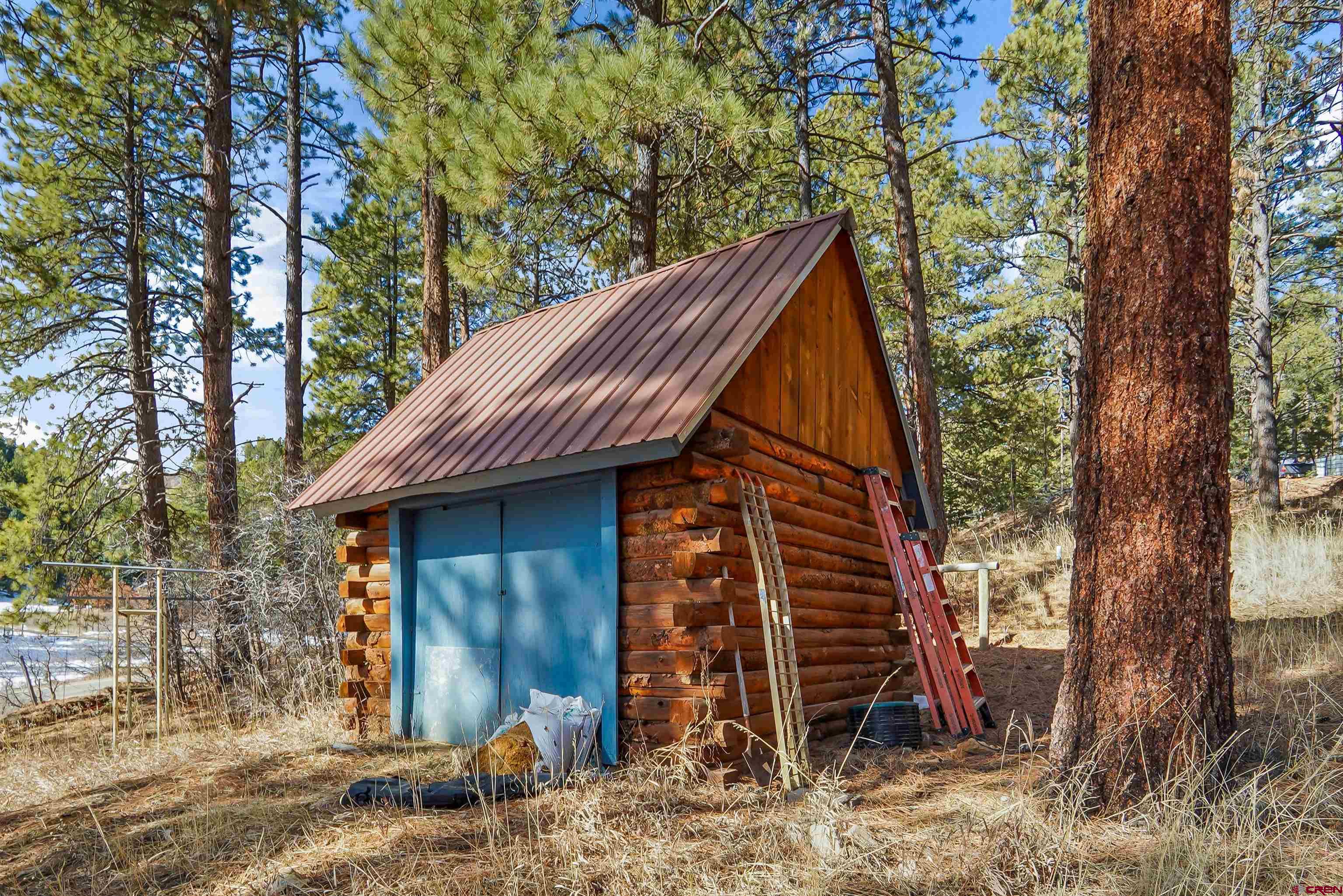 78 Groves Drive Durango, CO 81301 - Photo 7 of 35 a view of a house that has a small deck and a floor to ceiling window
